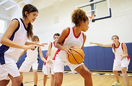 high school girls playing basketball