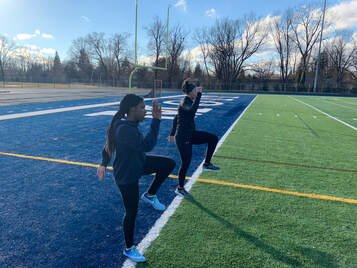 two young women training at the outdoor track